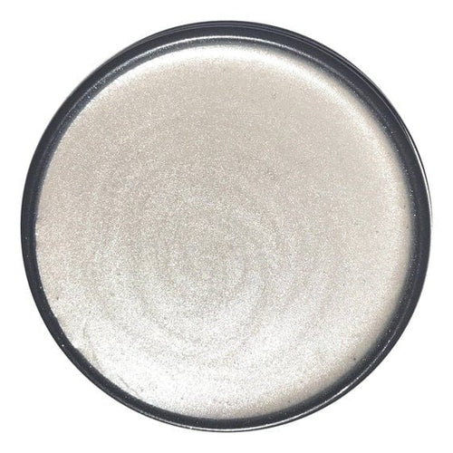 Drop of wise owl glaze in opalescent pearl on white background