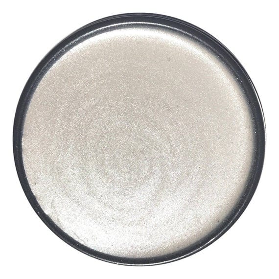 Drop of wise owl glaze in opalescent pearl on white background
