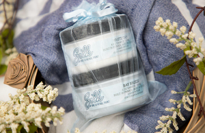 2 small containers of silk all-in-one mineral paint in white cap and bay breeze in a sachet wrapping 