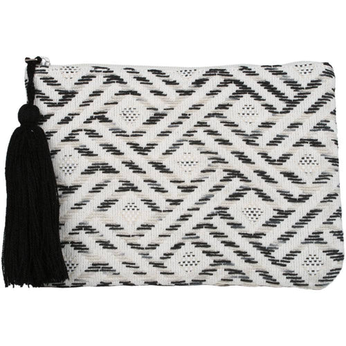 black, white, and beige clutch with black tassle on white background