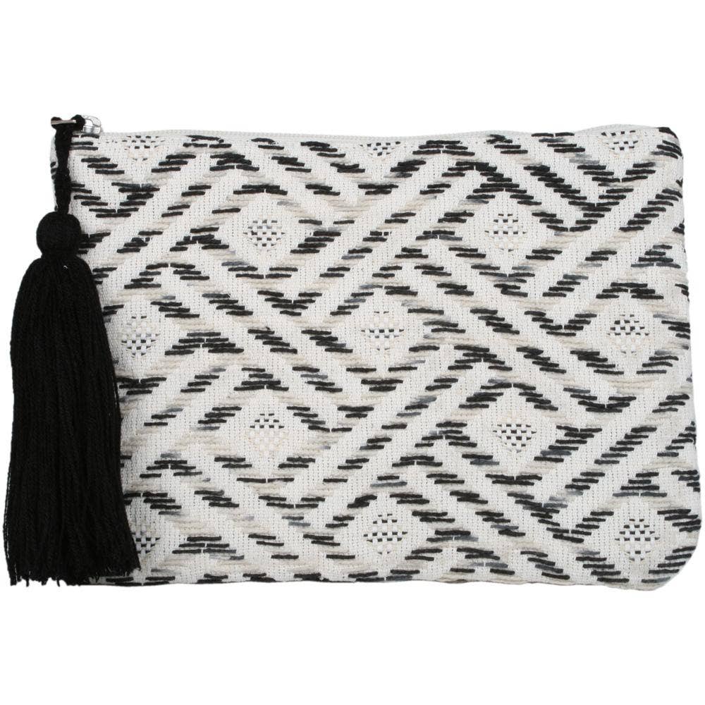 black, white, and beige clutch with black tassle on white background