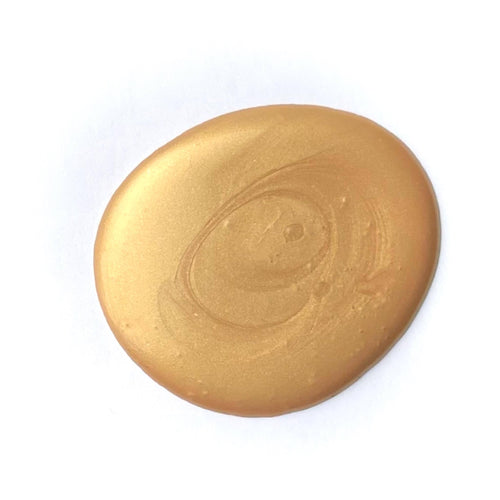 Paint drop of heavy metals metallic gilding paint on white background