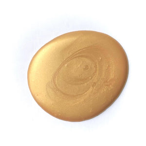 Paint drop of heavy metals metallic gilding paint on white background